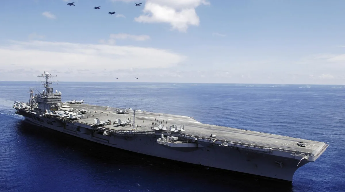 U.S. Carrier and Iran in Escalating Standoff Amid Missile Threats