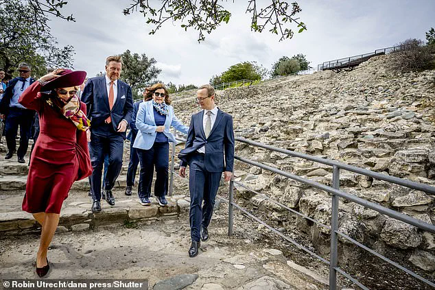 Queen Maxima of the Netherlands Visits Cyprus in Burgundy Elegance