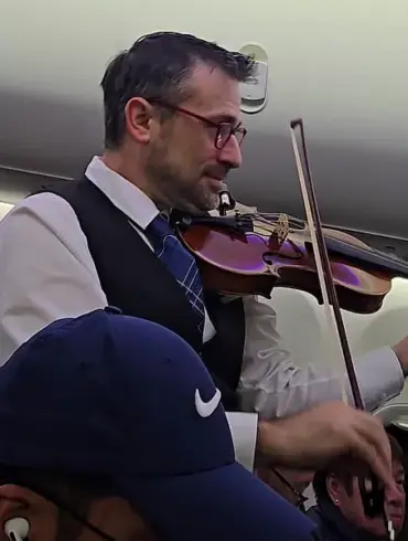 United Airlines Crew Member's Violin Performance Divides Online Audience