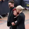 Sharon Osbourne Overcome with Grief as She Adds Flowers to Tributes for Late Husband Ozzy Osbourne, Heavy Metal Legend